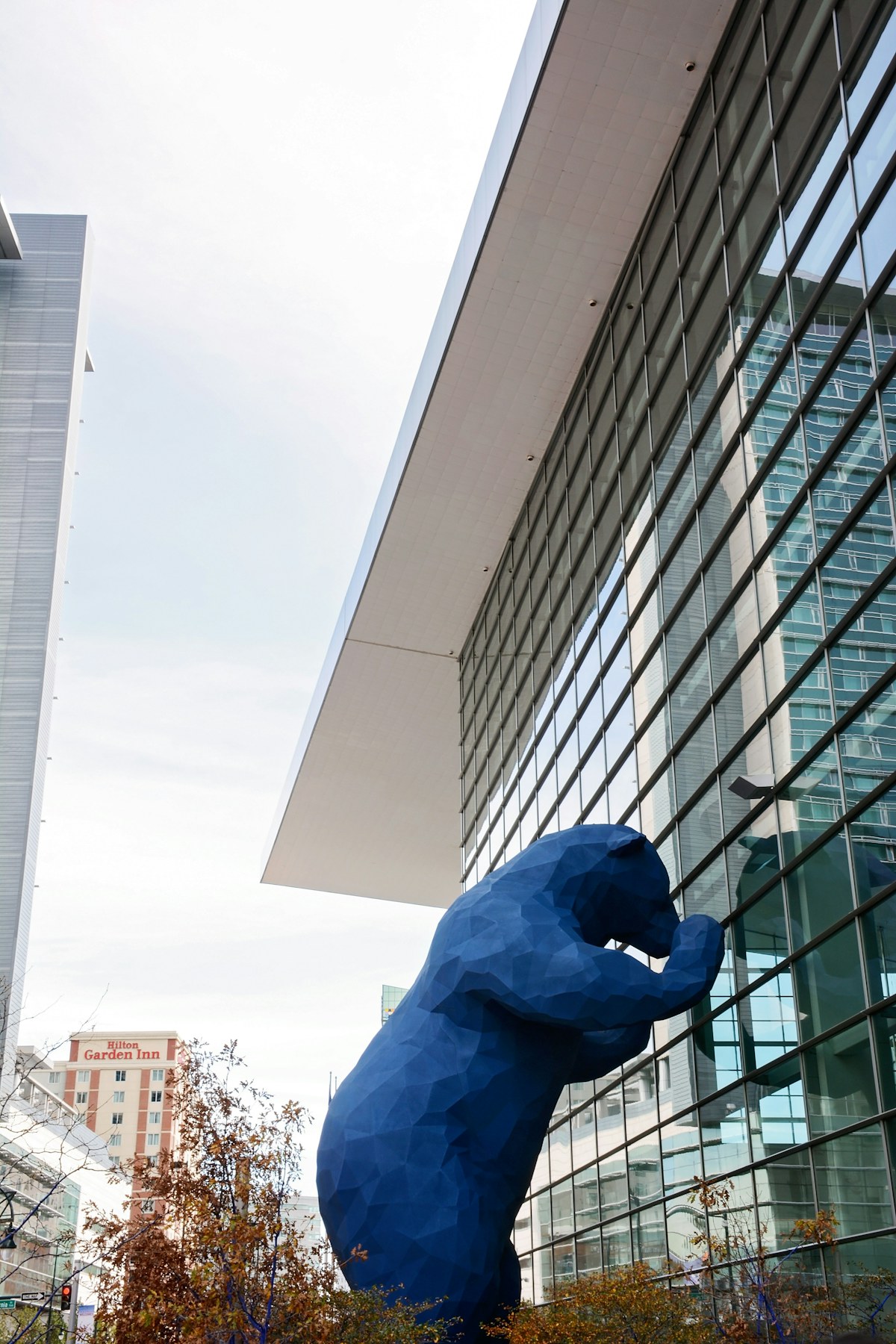 Large public sculpture beside a civic building